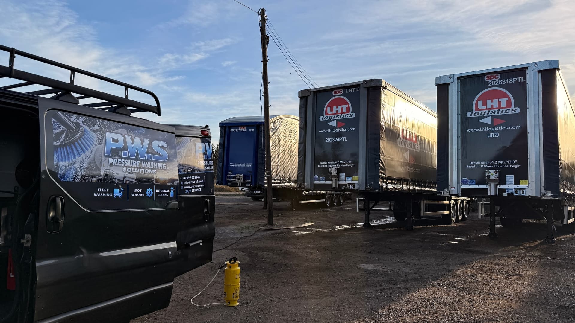 PWS mobile washing van beside a line of commercial fleet trailers